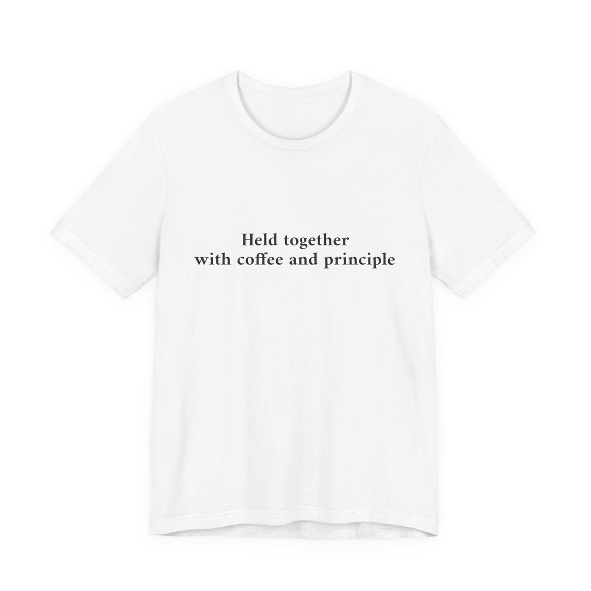A white short-sleeve crewneck t-shirt with the black printed text 'Held together with coffee and principle' on the chest, displayed against a solid white background.