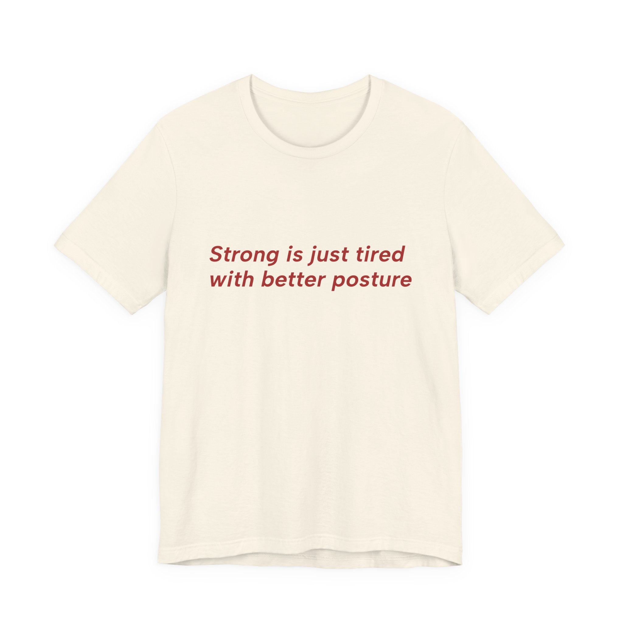 An off-white short-sleeve crewneck t-shirt with the text 'Strong is just tired with better posture' printed in red across the chest, displayed on a clean white background.