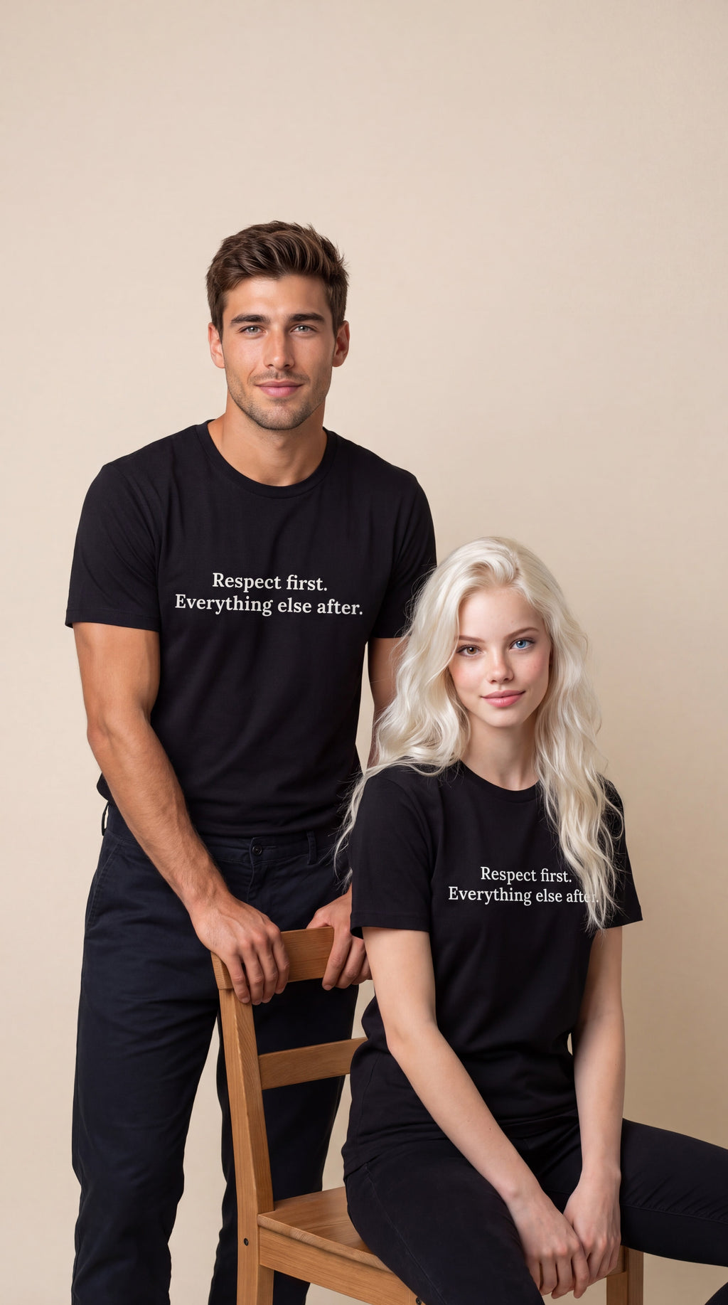 A man and a woman modeling matching black graphic t-shirts with the white printed text 'Respect first. Everything else after.