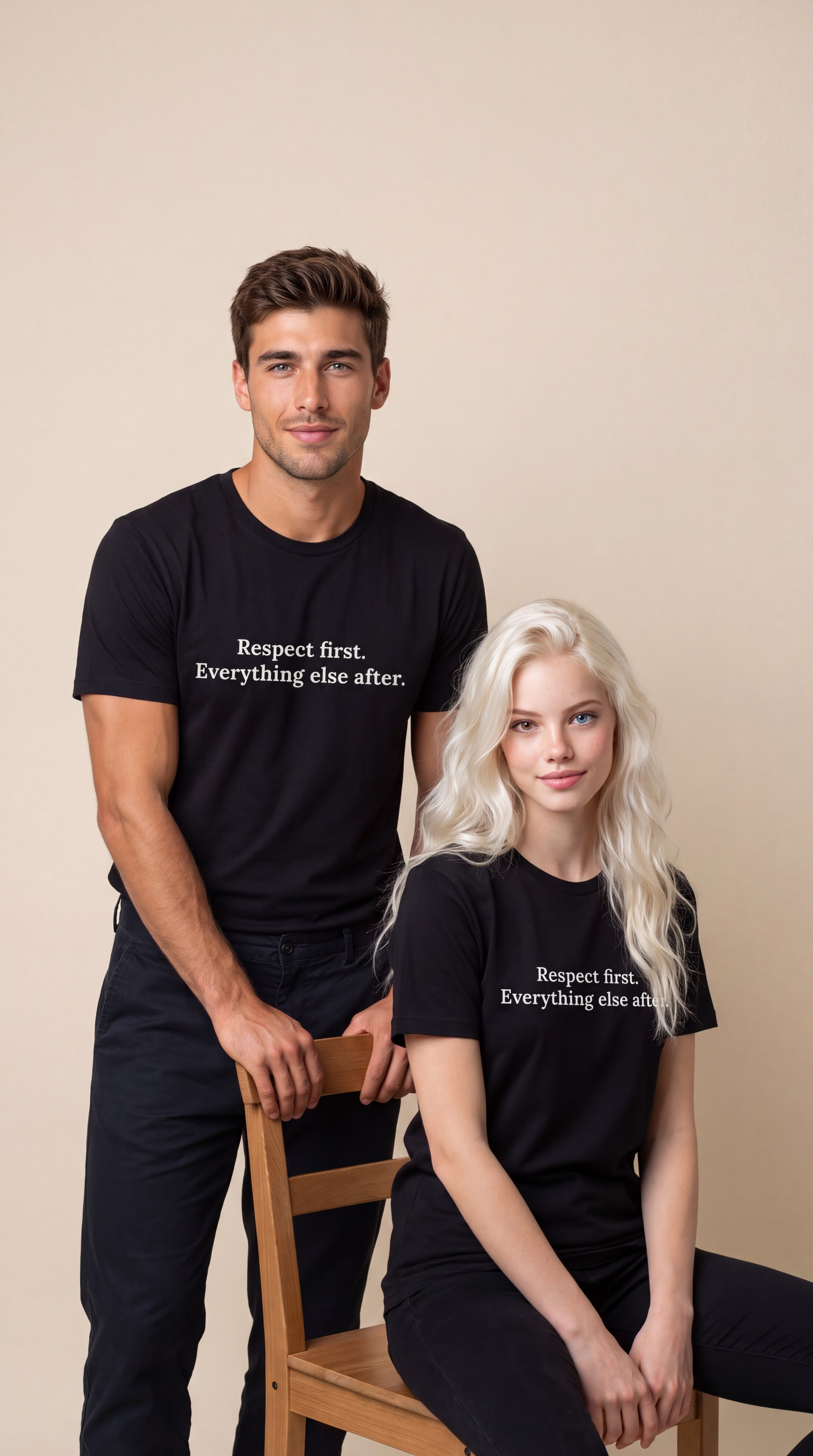 A man and a woman modeling matching black graphic t-shirts with the white printed text 'Respect first. Everything else after.